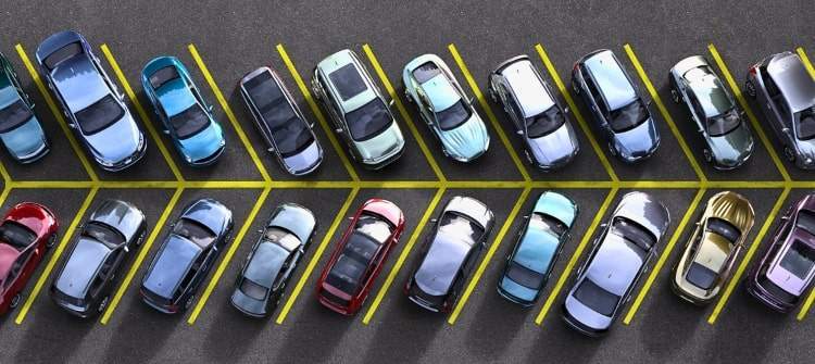 A crowded parking lot with no empty spaces, symbolizing hard-to-find good parking spots.