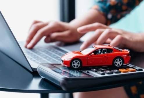 Online car loan pre-qualification with calculator and toy car.