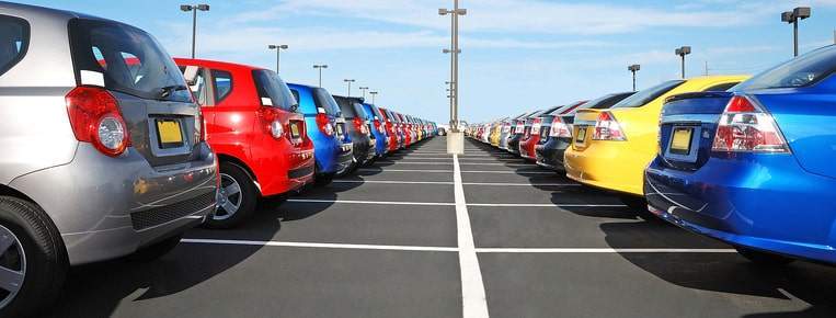 Rows of cars that are different colors. What color car should I buy?